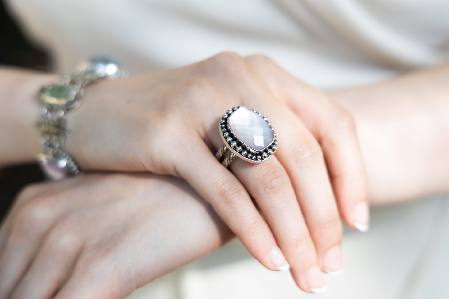 Sterling cushion rectangle ring with amethyst doublet and beaded border (Wisteria 2008).