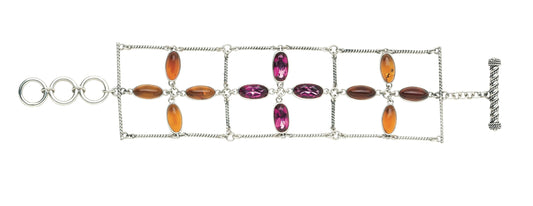 Sterling silver three-strand oval flower link bracelet with amber and raspberry topaz and twisted rope bar links with toggle closure, Parisian Muse Collection 2004, Lori Bonn Archive.