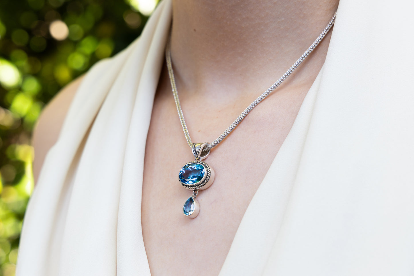 Pendant necklace with oval and pear Swiss blue topaz stones on foxtail chain
