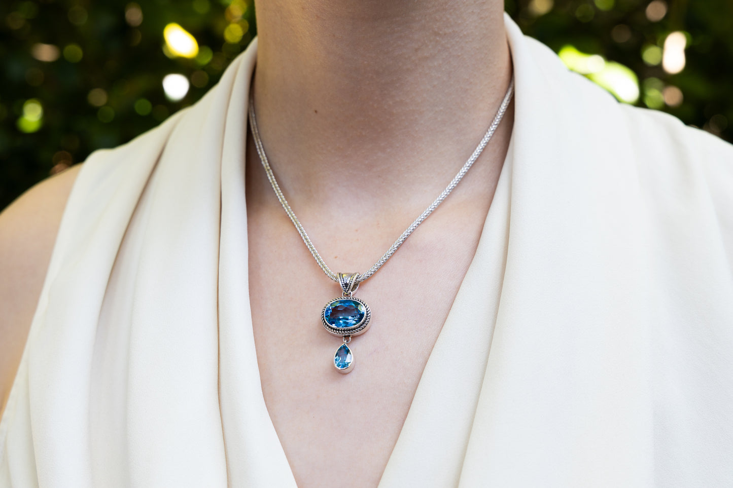Pendant necklace with oval and pear Swiss blue topaz stones on foxtail chain