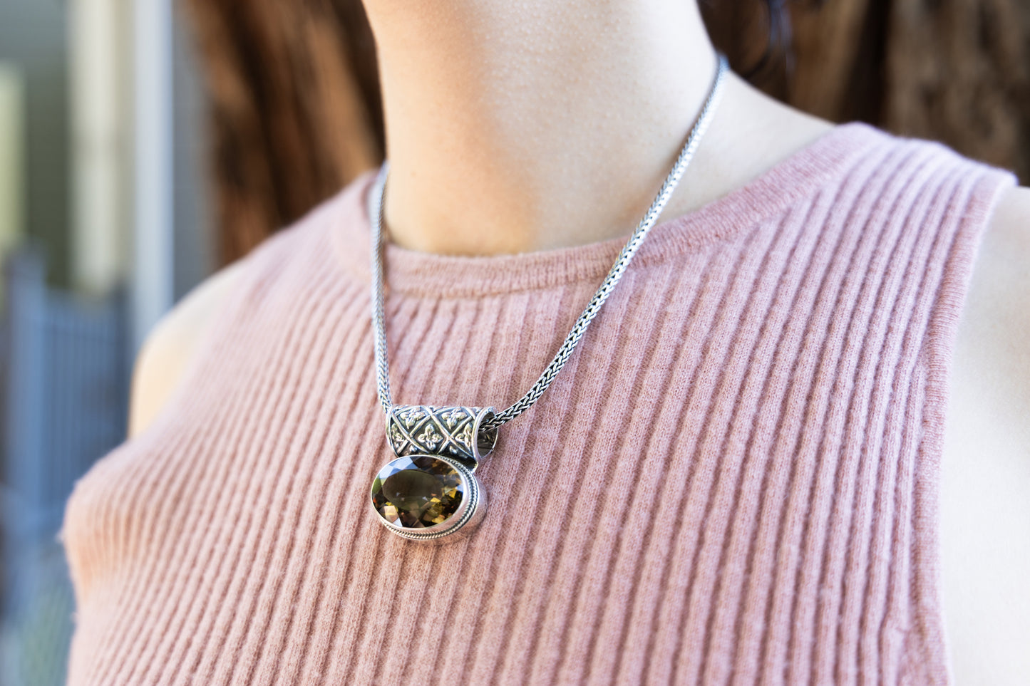 Sterling silver oval smoky quartz pendant on handwoven snake chain with enhancer bale.