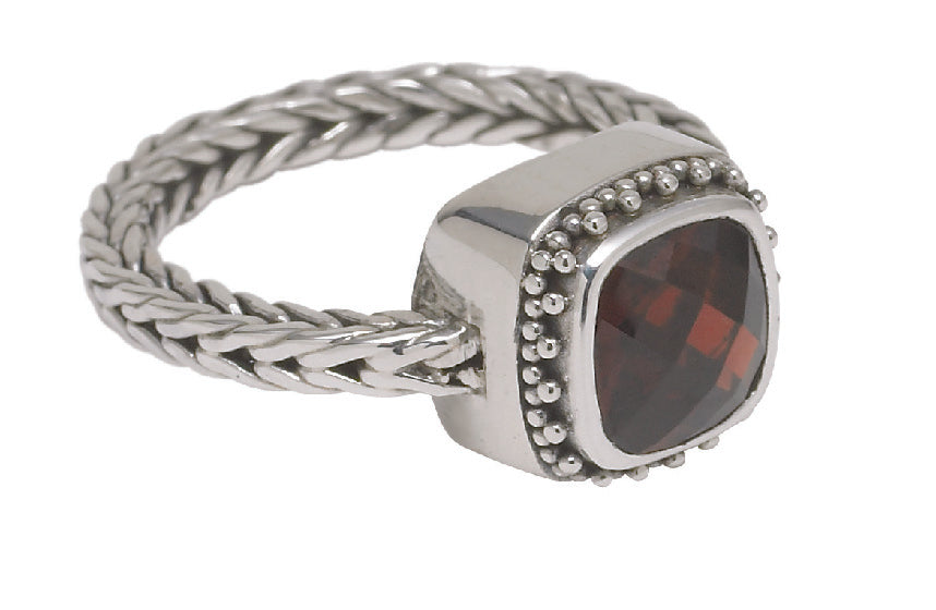 Sterling silver handwoven foxtail ring with faceted cushion-cut garnet in granulated bezel setting, Cognac Collection 2005, Lori Bonn Archive.