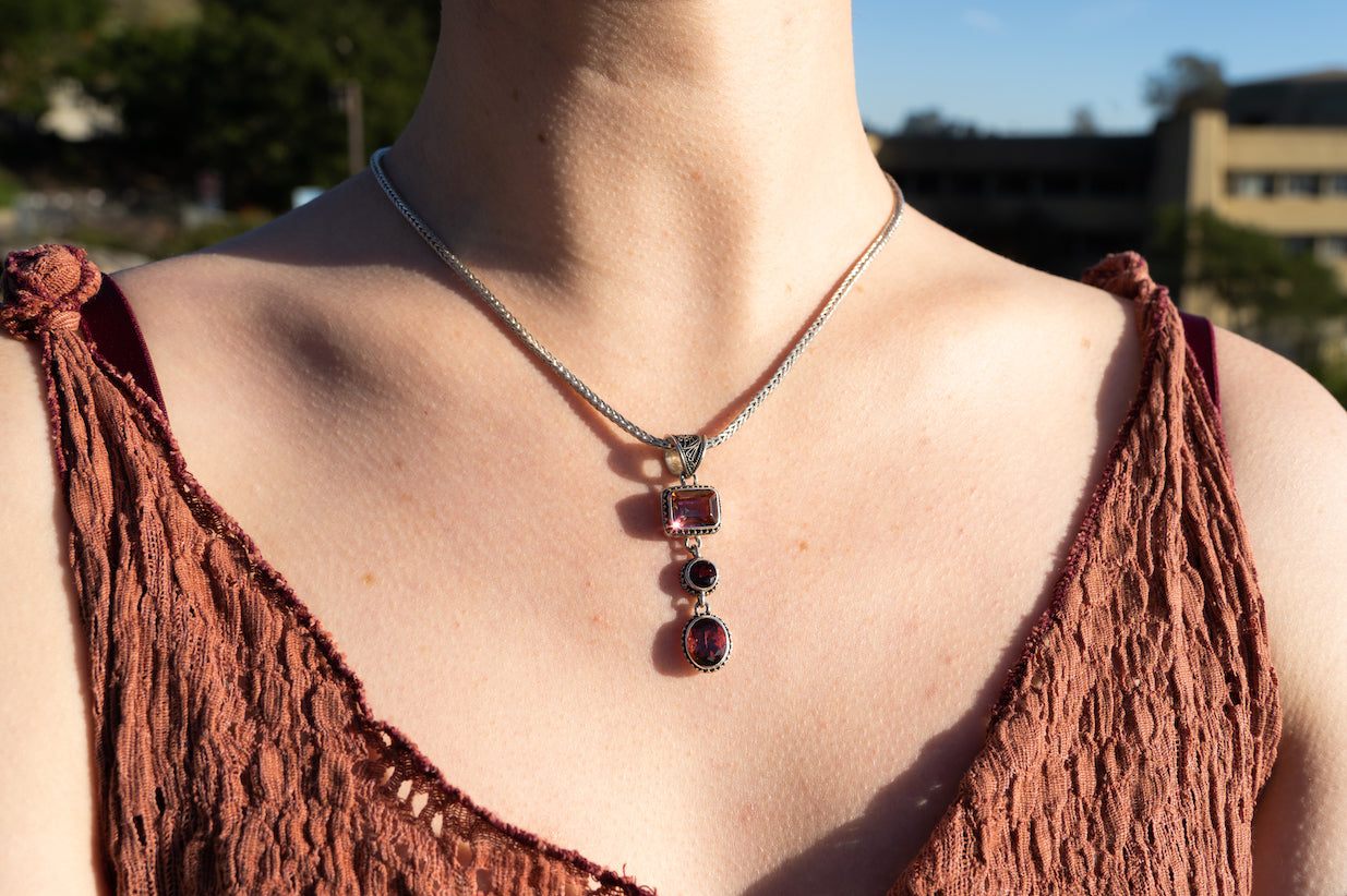 Three-stone pendant necklace with twilight topaz and gypsy red topaz on sterling silver foxtail chain