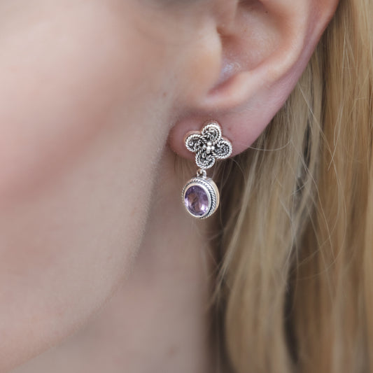 Sterling silver drop earrings with twisted rope clover post and faceted oval amethyst drop on model.  Heirloom Collection 2002, Lori Bonn Archive.