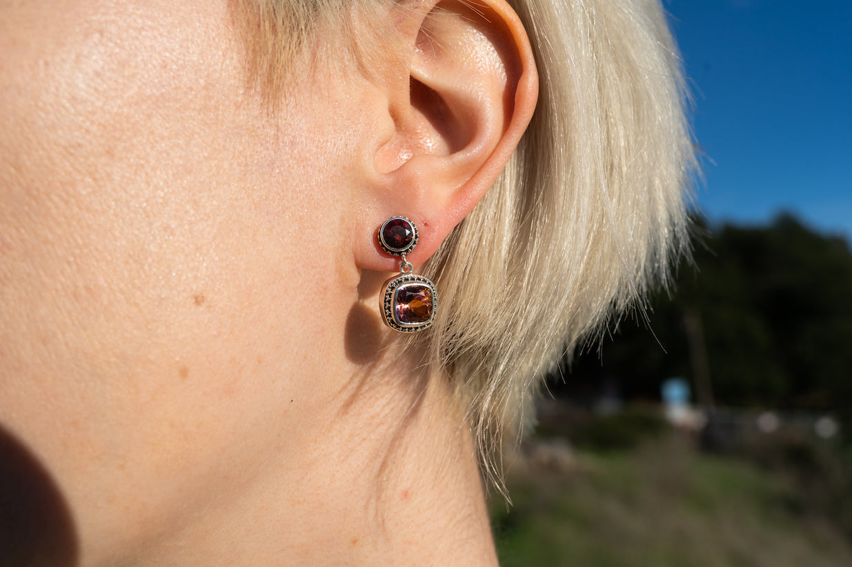 Two-stone drop earrings with gypsy red topaz stud and twilight topaz cushion drop in granulated silver