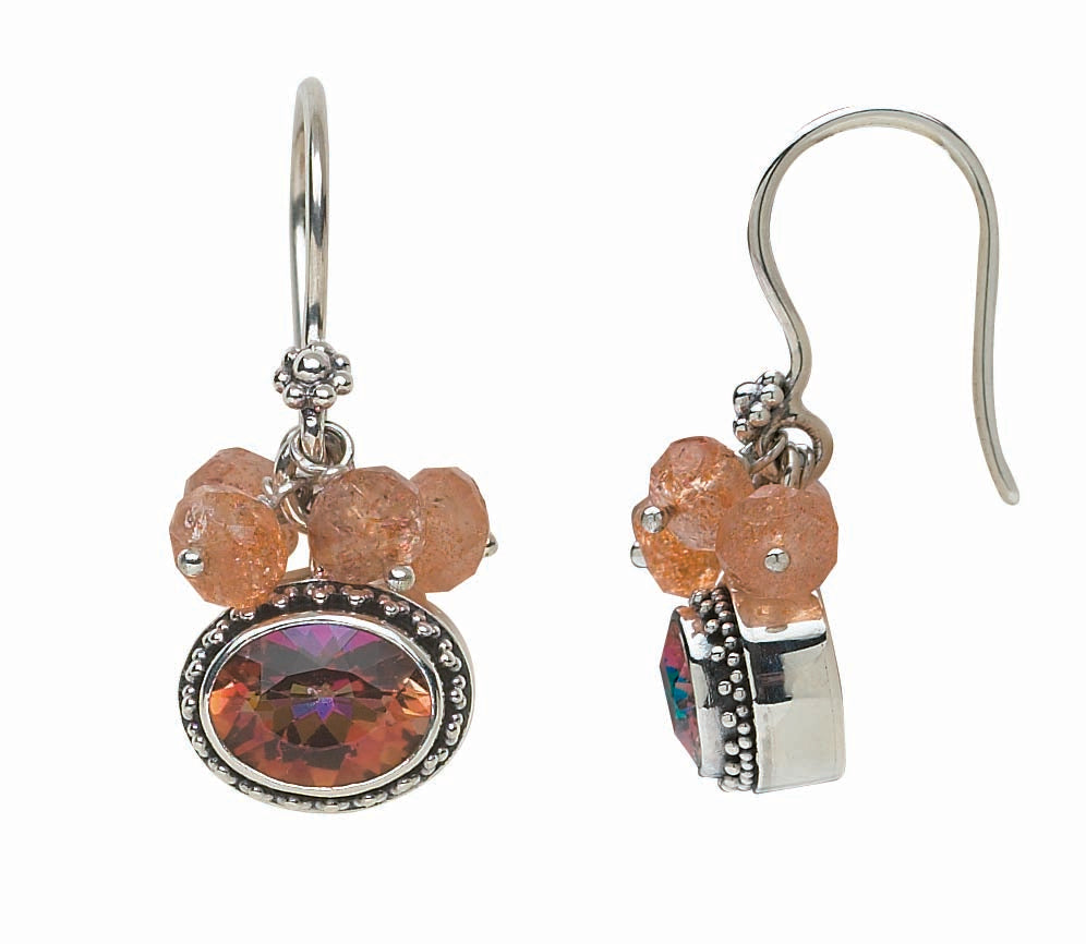 Sterling silver drop earrings with faceted oval twilight topaz in granulated bezels and clusters of faceted sunstone beads on French wires. Parisian Muse Collection, 2004, Lori Bonn Archive.