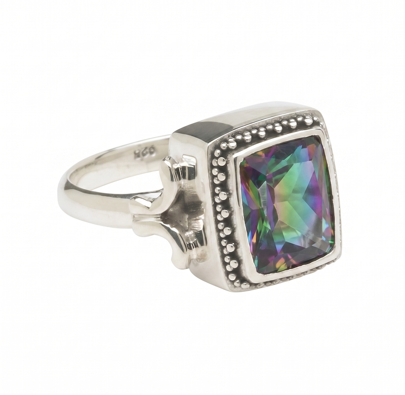 Sterling silver ring with cushion-cut mystic fire topaz in beaded bezel and wrought-iron pattern shank from the Lori Bonn Parisian Muse 2004 Archive collection.
