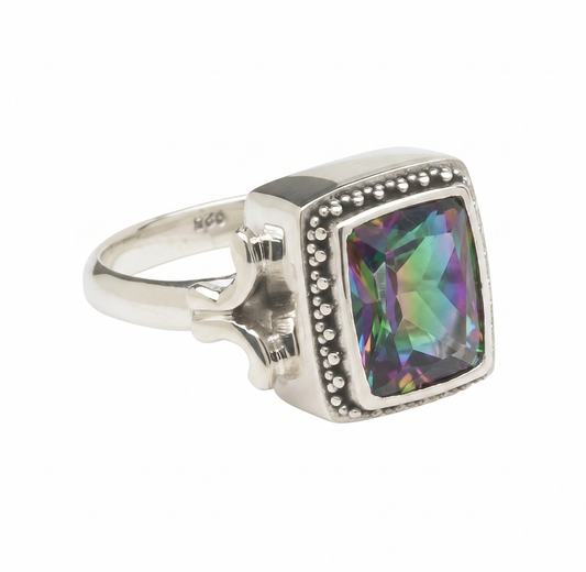 Sterling silver ring with cushion-cut mystic fire topaz in beaded bezel and wrought-iron pattern shank from the Lori Bonn Parisian Muse 2004 Archive collection.
