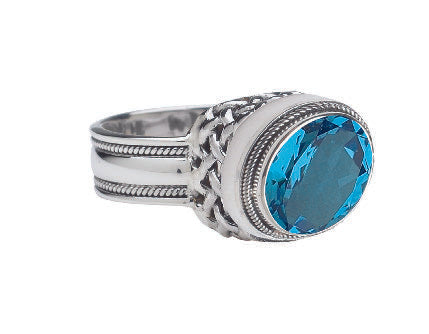 Sterling silver ring with oval Swiss blue topaz and trellis detailing, size 9
