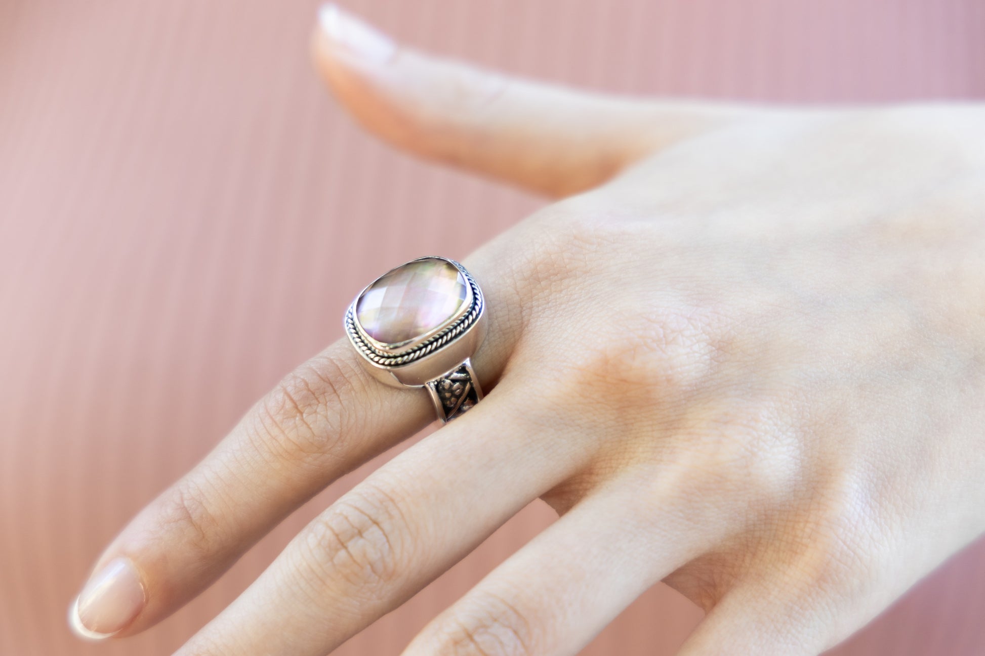 Sterling silver cushion-cut ring with mocha pearl doublet and floral repoussé shank