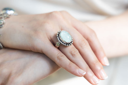 Sterling oval ring with cabochon aspen wood quartz and rope bezel (Wisteria 2008).

