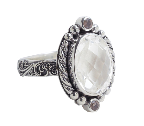 Oval faceted white-quartz ring with granulated halo, smoky-quartz accents, and scroll-filigree sterling shank – Chrysalis 2008 archive