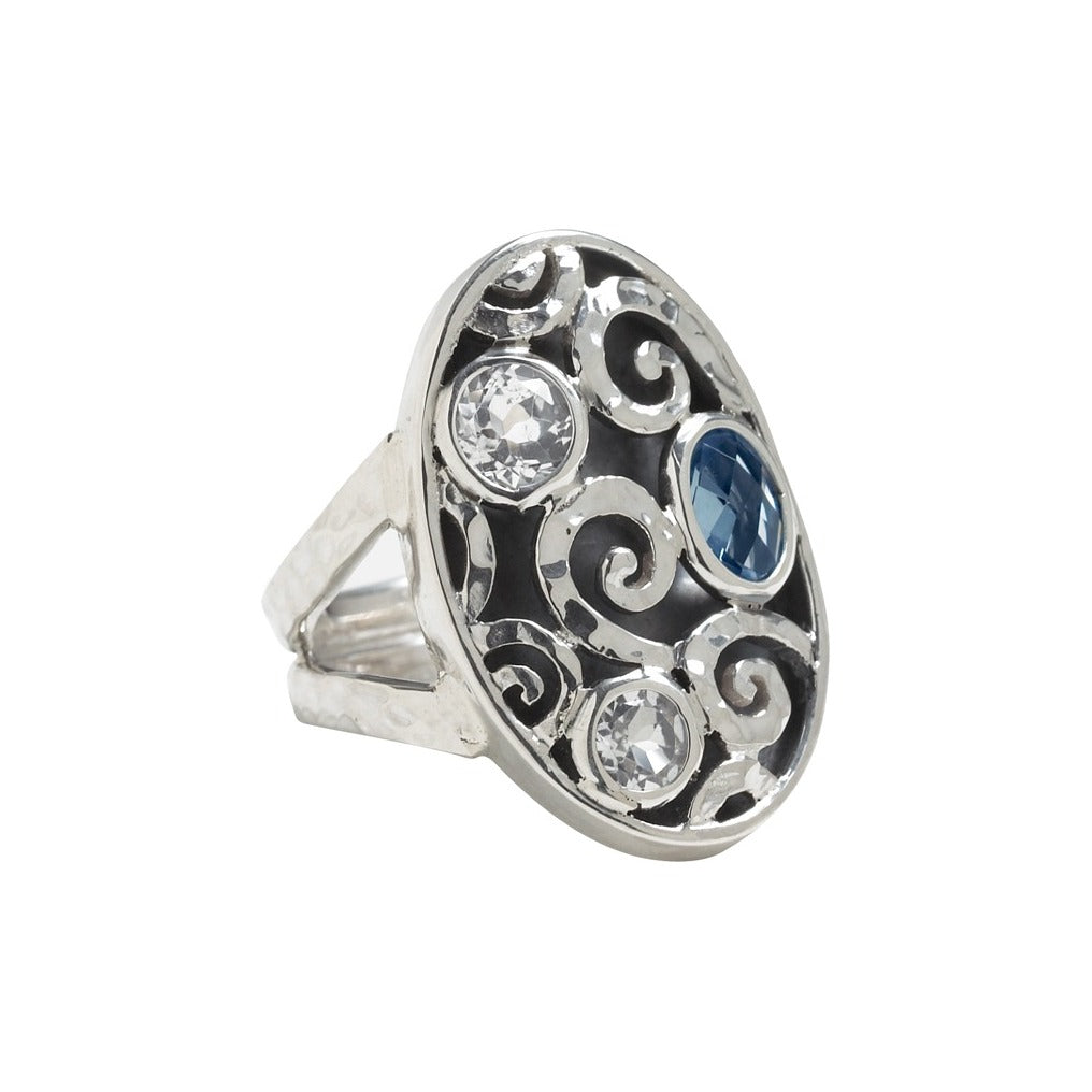 Sterling silver cocktail ring with hand-hammered swirl pattern, oxidized relief, and white quartz and blue spinel briolettes, size 8, Lori Bonn Splash Collection 2009 Archive.