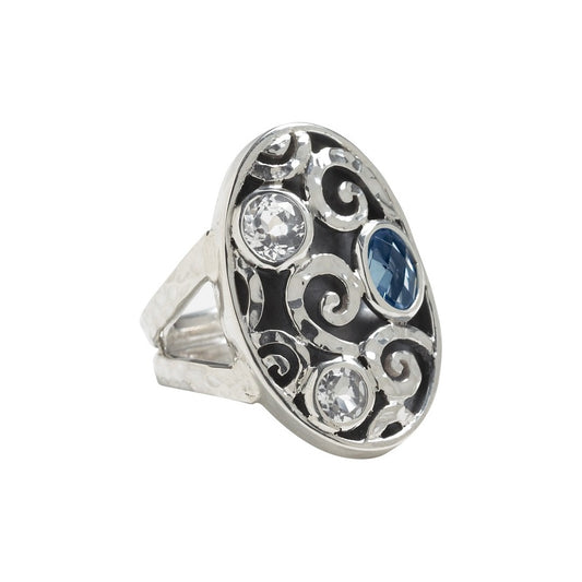 Sterling silver cocktail ring with hand-hammered swirl pattern, oxidized relief, and white quartz and blue spinel briolettes, size 8, Lori Bonn Splash Collection 2009 Archive.