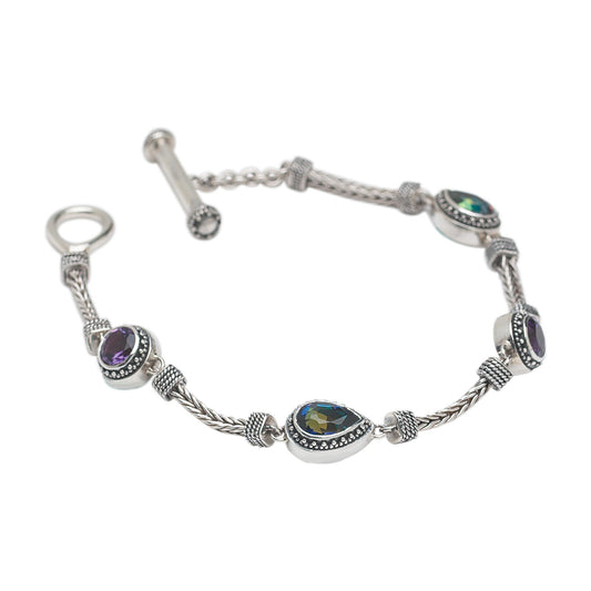 Sterling silver handwoven foxtail chain bracelet with pear and round amethyst and mystic fire topaz stations, toggle clasp, Lori Bonn Heirloom Collection 2002 Archive.