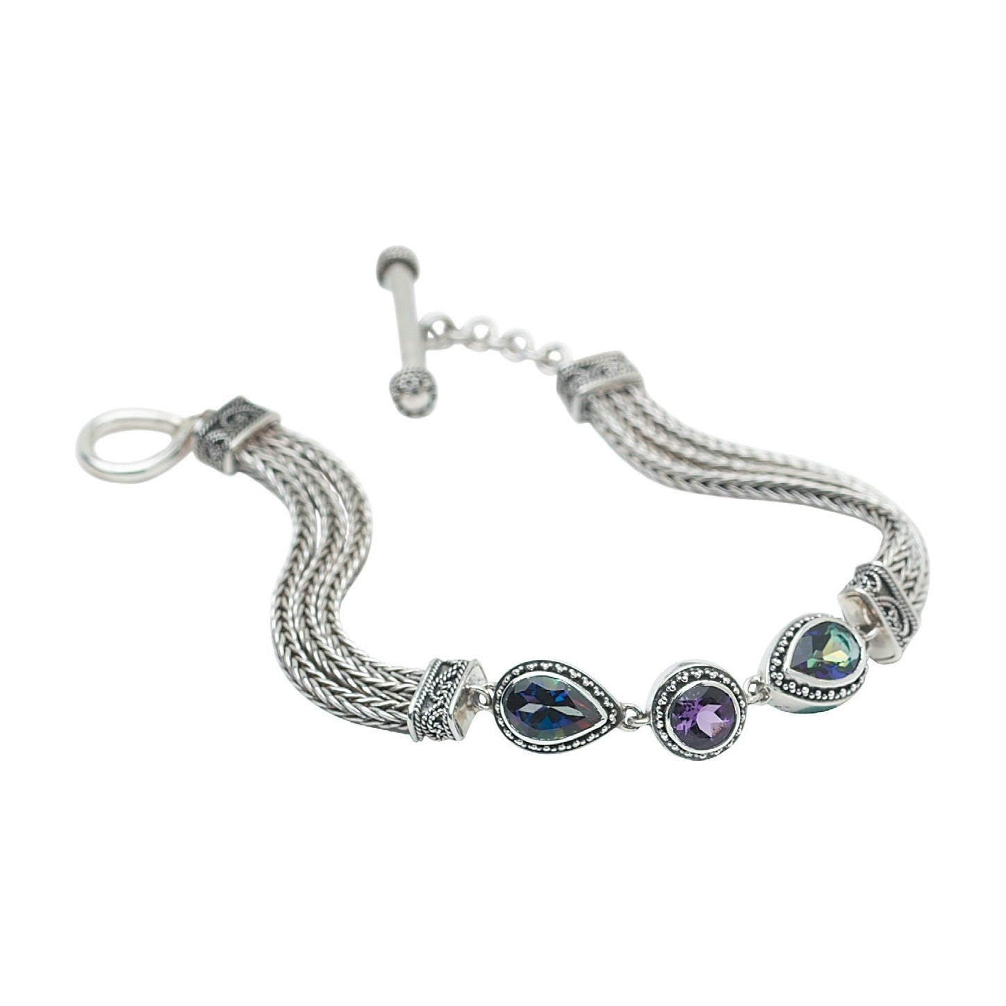 Sterling silver triple handwoven foxtail chain bracelet with round amethyst and pear mystic fire topaz center station, toggle clasp, Lori Bonn Heirloom Collection 2002 Archive.