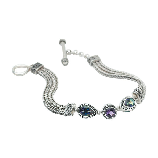 Sterling silver triple handwoven foxtail chain bracelet with round amethyst and pear mystic fire topaz center station, toggle clasp, Lori Bonn Heirloom Collection 2002 Archive.