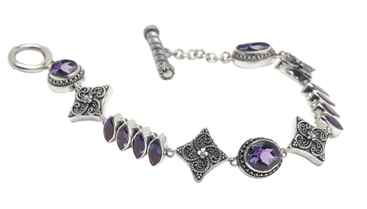 Sterling silver link bracelet with oval and marquis amethyst stones and granulated star links with toggle clasp, Heirloom Collection 2002, Lori Bonn Archive.