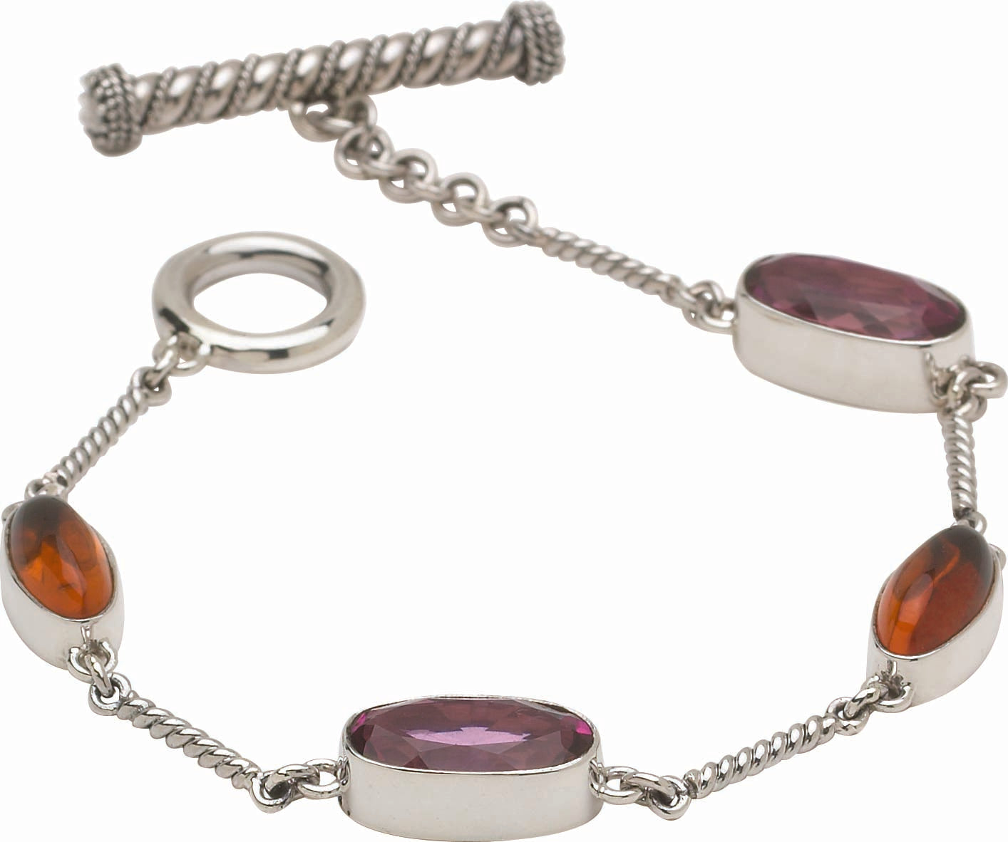 Sterling silver station bracelet with faceted raspberry topaz ovals and Baltic amber cabochons on twisted rope chain with toggle clasp, Parisian Muse Collection 2004, Lori Bonn Archive.