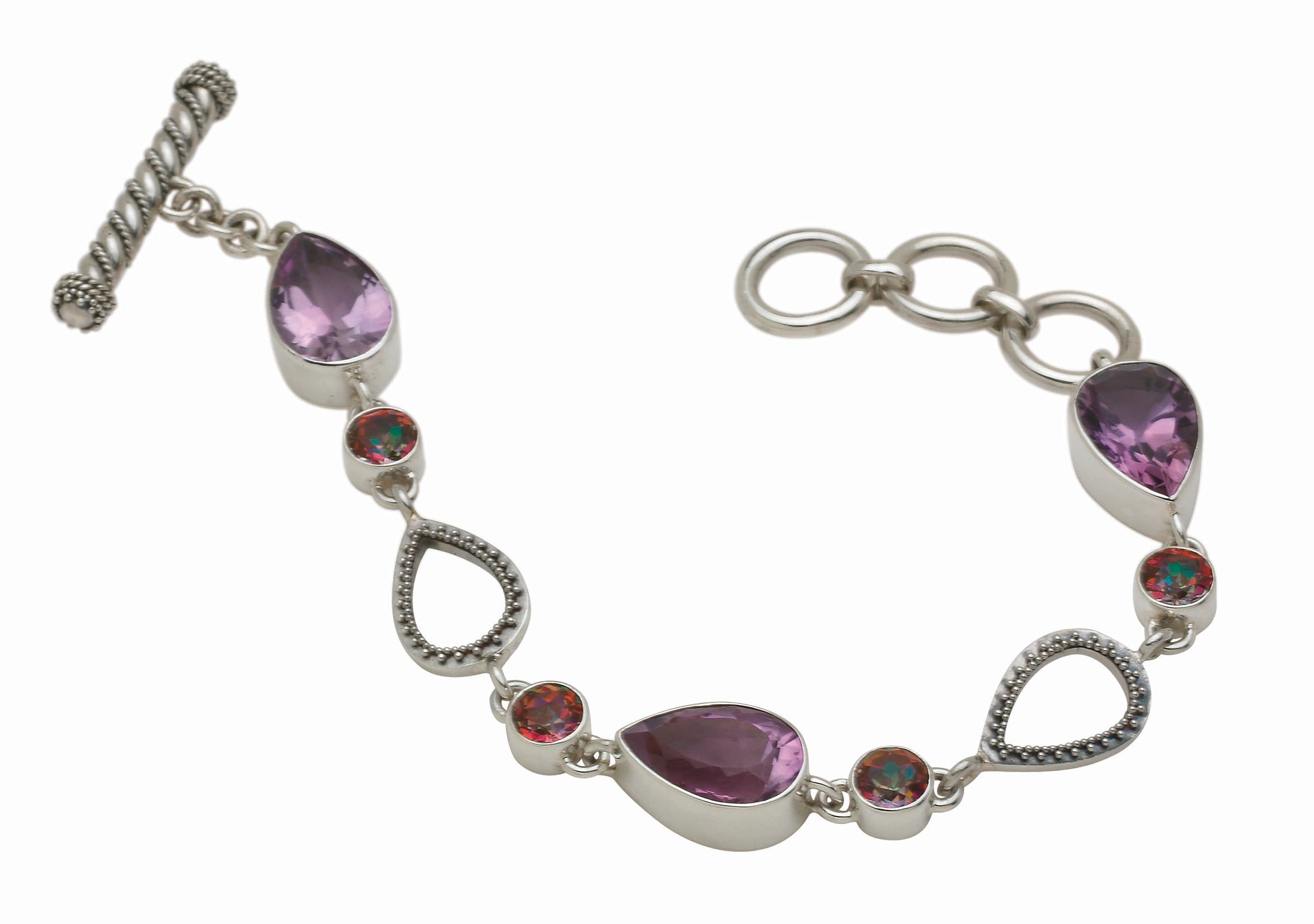 Sterling silver link bracelet with three pear-cut amethysts, round twilight topaz, and granulated open teardrop links with toggle closure, Parisian Muse Collection 2004, Lori Bonn Archive