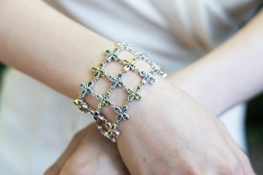 Wide sterling silver clover link bracelet with Swiss blue topaz and peridot