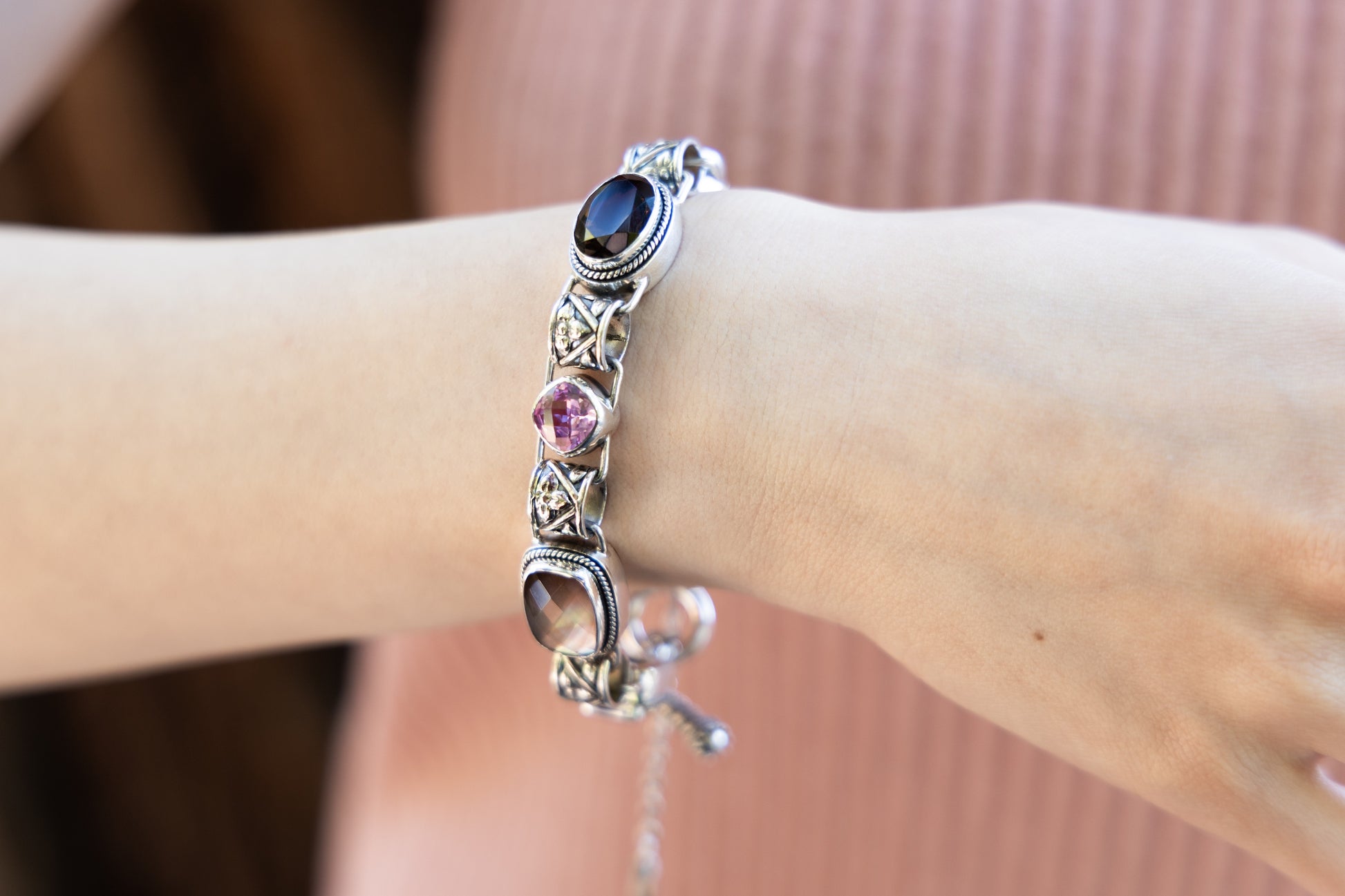 Sterling silver link bracelet with mocha pearl, smoky quartz, and pink sapphire cushion stones
