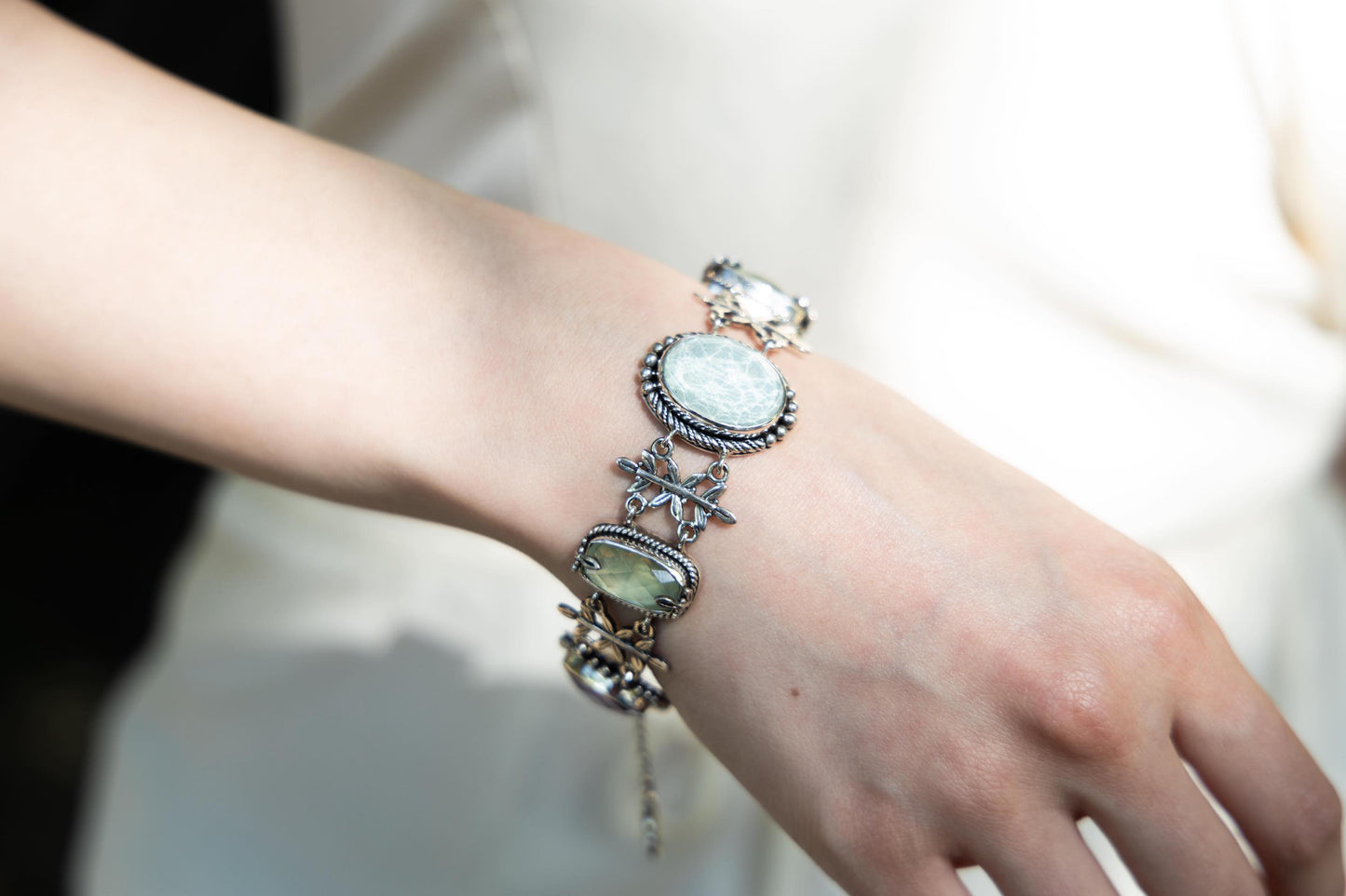 Sterling-silver Wisteria bracelet with leaf links and bezel-set amethyst doublets, prehnite, and aspen wood quartz – 2008 Lori Bonn Archive