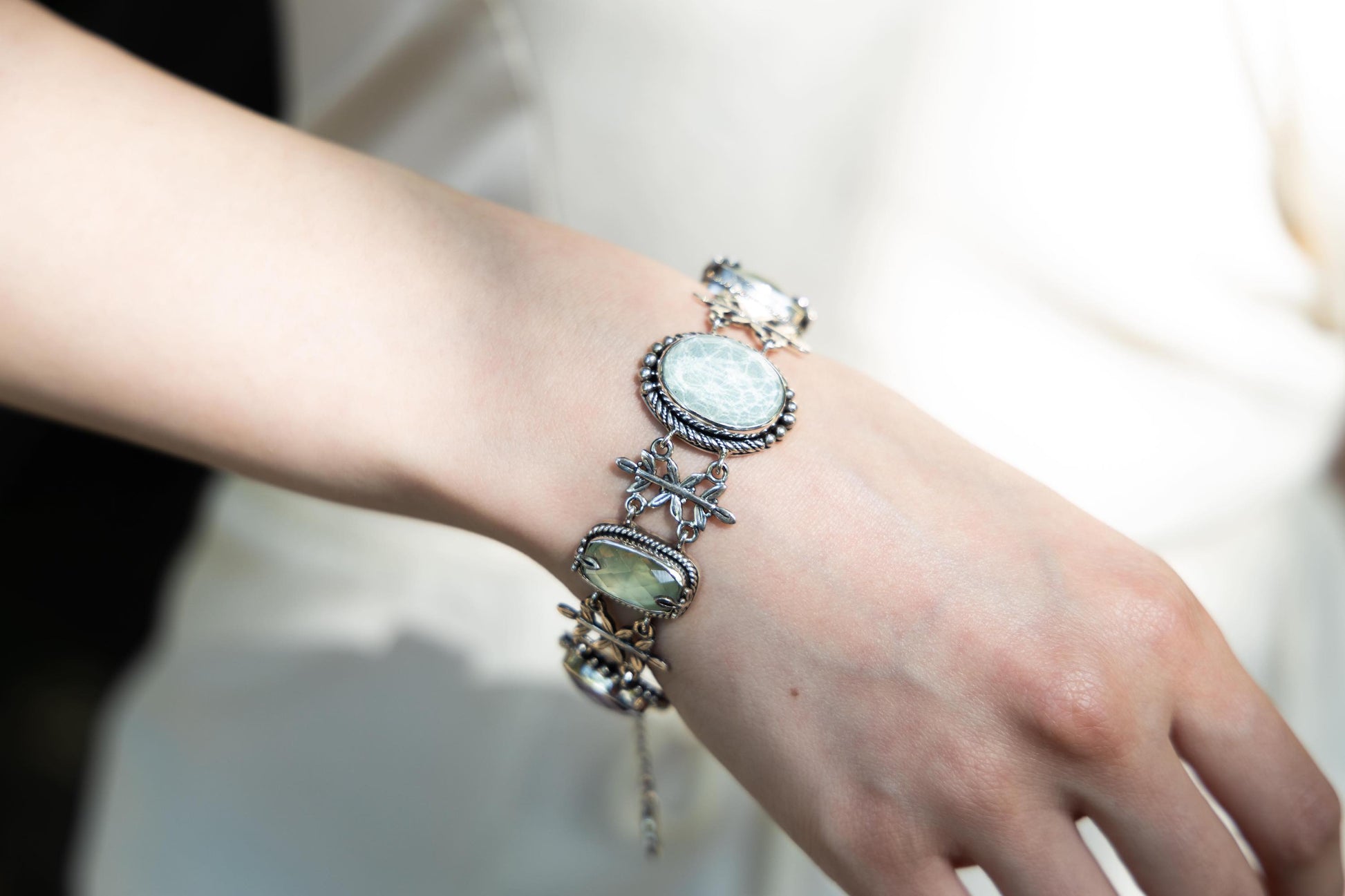 Sterling-silver Wisteria bracelet with leaf links and bezel-set amethyst doublets, prehnite, and aspen wood quartz – 2008 Lori Bonn Archive