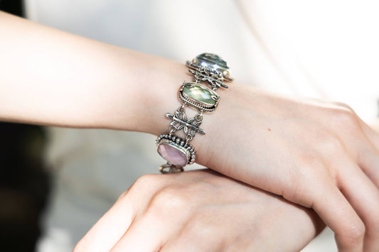 Sterling-silver Wisteria bracelet with leaf links and bezel-set amethyst doublets, prehnite, and aspen wood quartz – 2008 Lori Bonn Archive