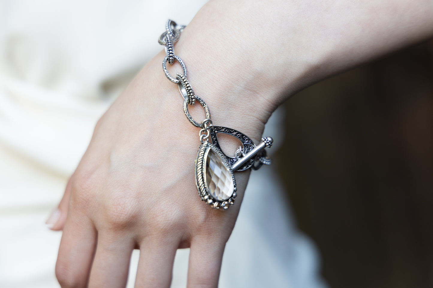Sterling-silver charm bracelet with faceted smoky-quartz teardrop and toggle clasp, Chrysalis 2008 archive sample