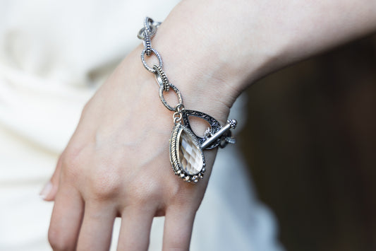 Sterling-silver charm bracelet with faceted smoky-quartz teardrop and toggle clasp, Chrysalis 2008 archive sample