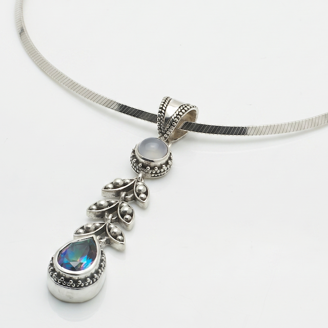 Sterling silver pendant necklace with chalcedony cabochon, granulated leaf vine link, and pear-shaped mystic fire topaz on square magic chain, Heirloom Collection 2002, Lori Bonn Archive.