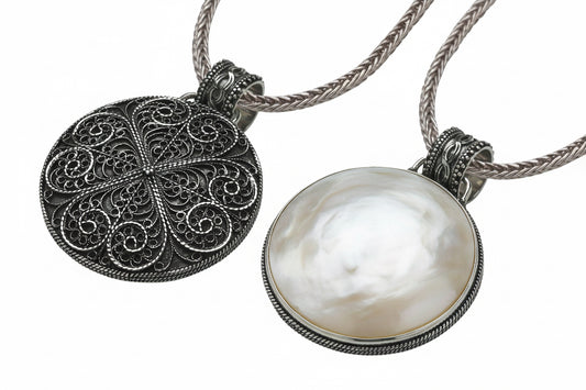 Reversible sterling silver pendant with mother of pearl and filigree detailing on an 18-inch handwoven foxtail chain from the Blush 2006 Collection.