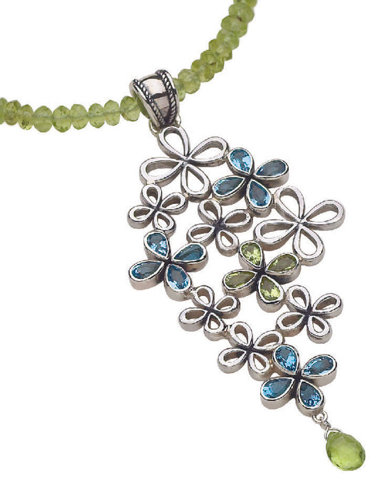 Sterling silver clover cluster pendant with topaz and peridot on faceted bead strand