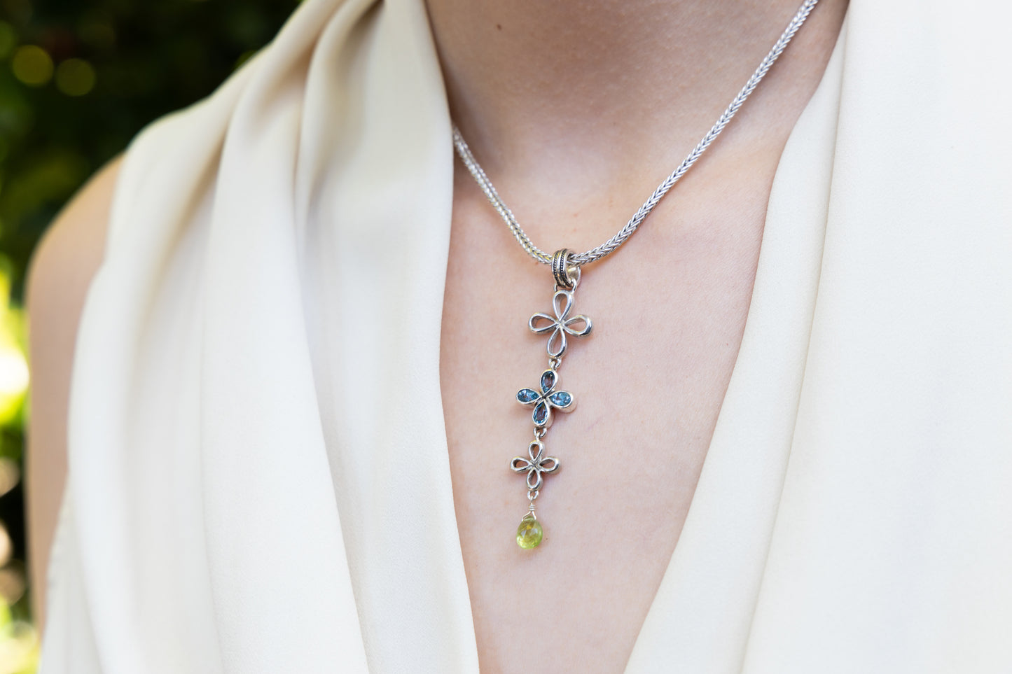 Vertical clover drop necklace with blue topaz and peridot on foxtail chain