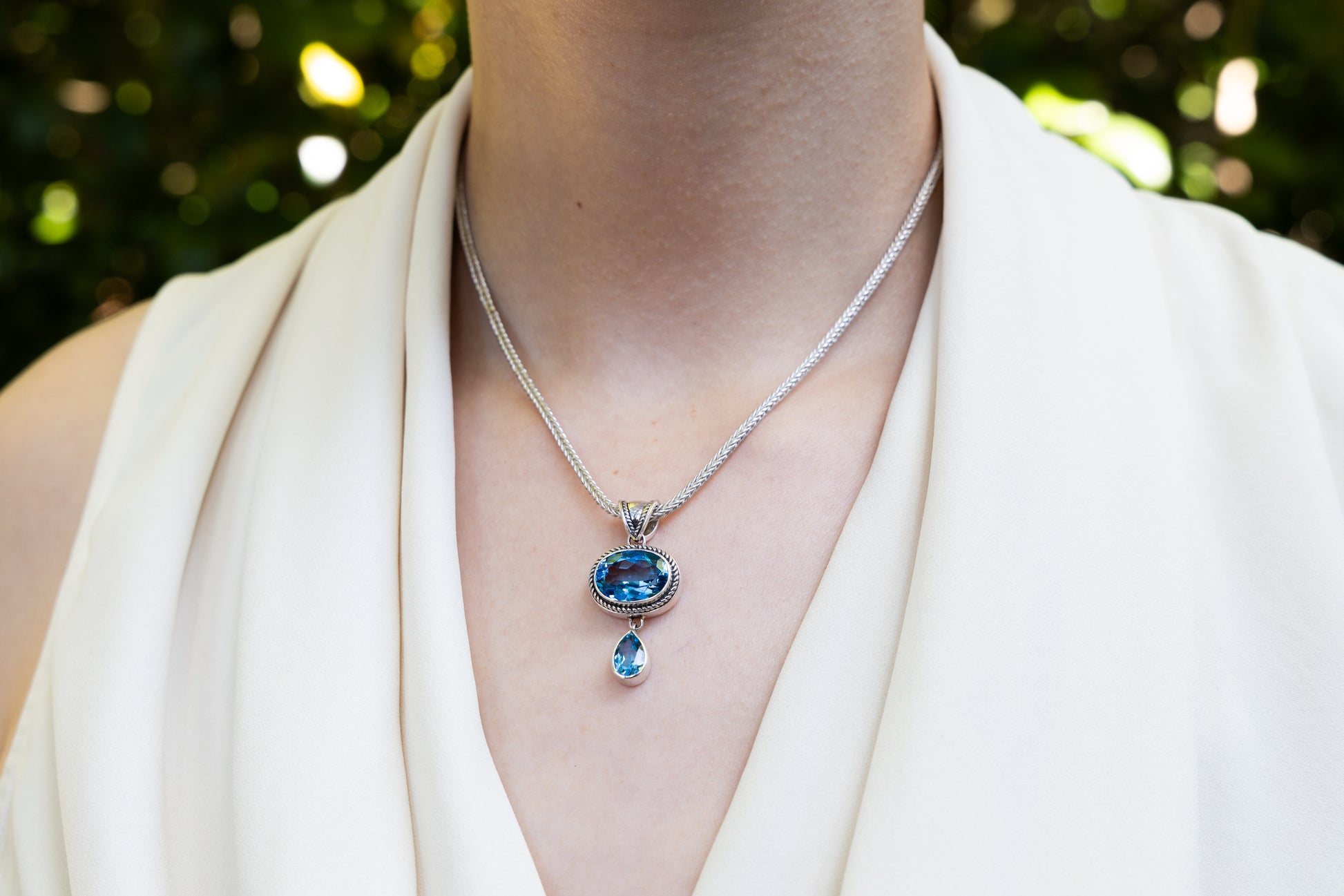 Pendant necklace with oval and pear Swiss blue topaz stones on foxtail chain