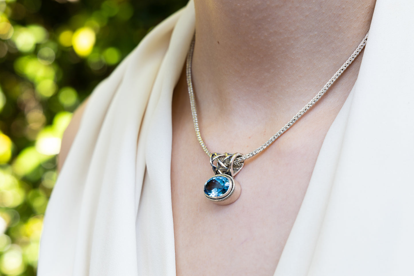 Sterling silver foxtail necklace with oval Swiss blue topaz pendant