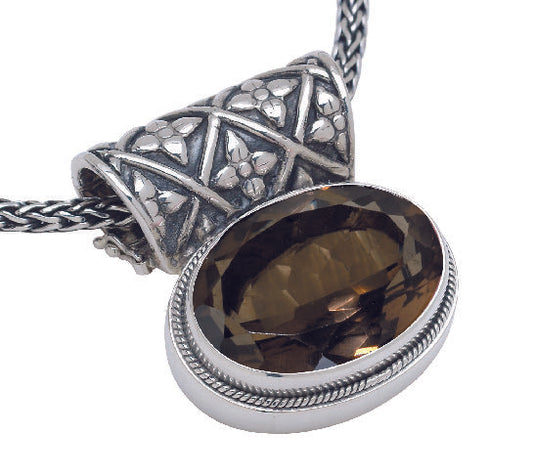 Sterling silver oval smoky quartz pendant on handwoven snake chain with enhancer bale.