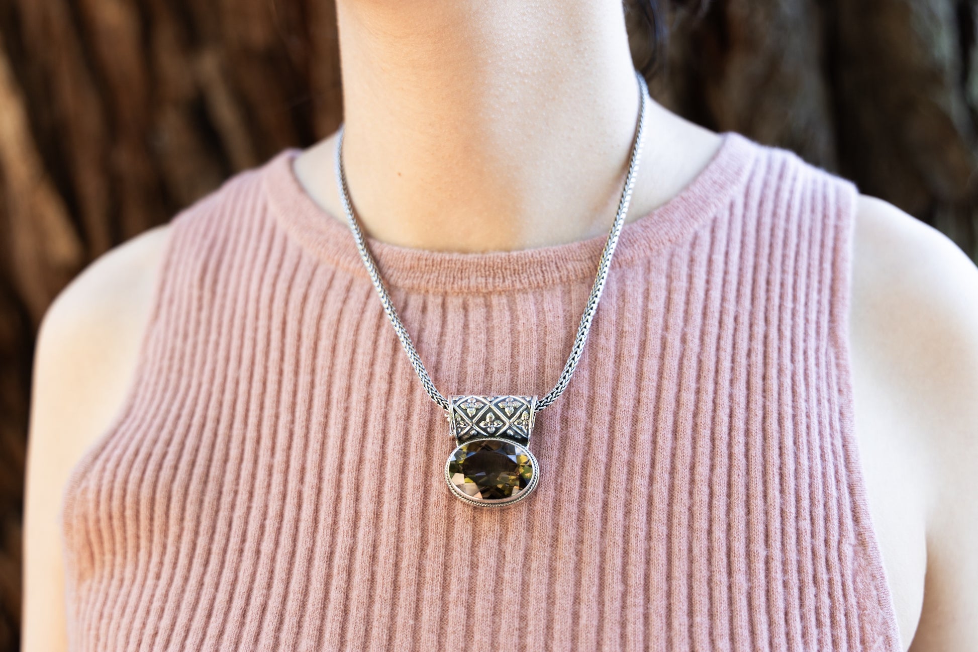 Sterling silver oval smoky quartz pendant on handwoven snake chain with enhancer bale.