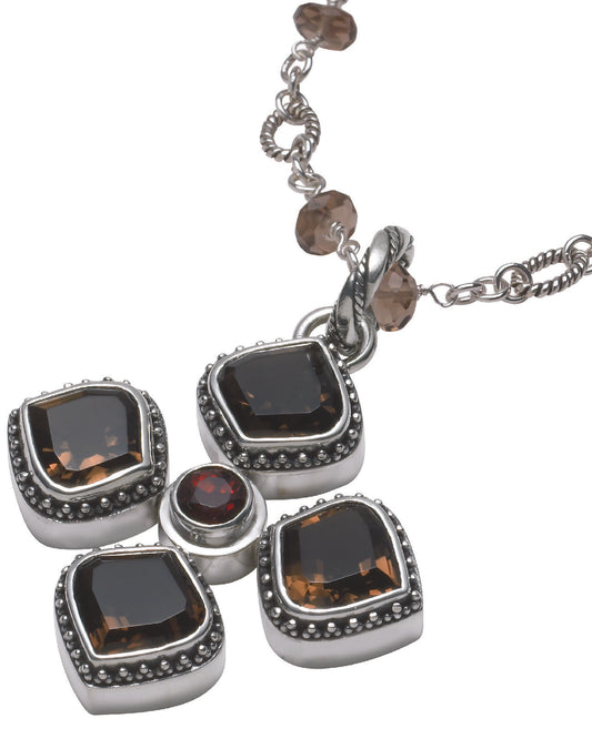 Sterling silver medallion necklace with four lotus-cut smoky quartz stones and a center garnet, on an adjustable handmade brio link chain with smoky quartz stations, from the Cognac 2005 Archive.