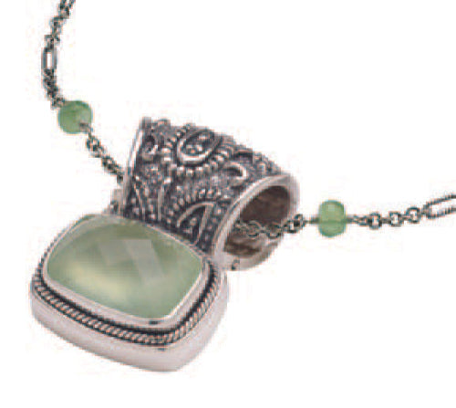 Sterling silver pendant with cushion-cut prehnite and ornate paisley bail on a figaro chain accented with small prehnite rondelles.