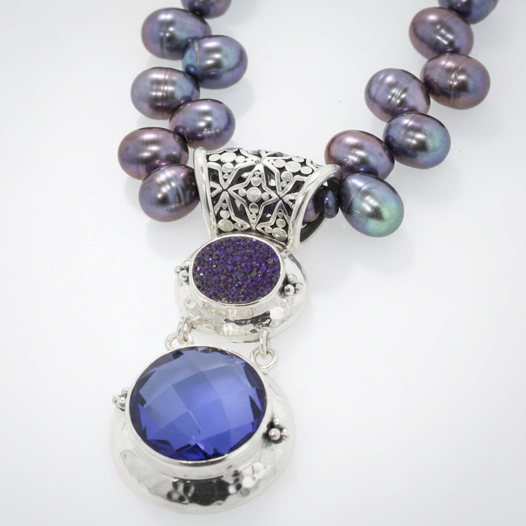 Sterling silver pendant with blue drusy and created blue sapphire on peacock pearl strand, Windsor Collection 2009, Lori Bonn Archive.