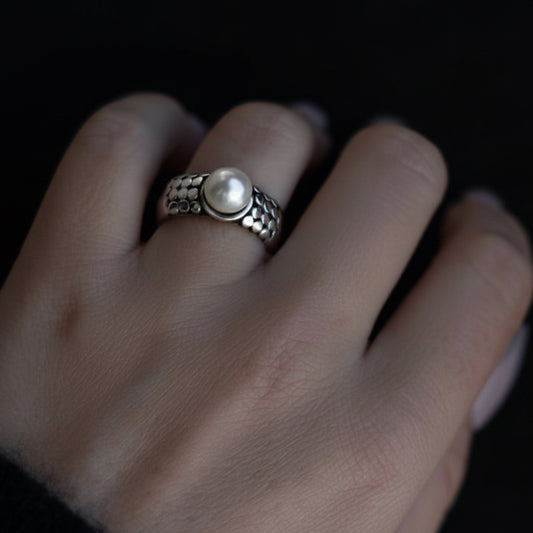Sterling silver pearl ring with circular granulation detailing from the Blush 2006 Collection.