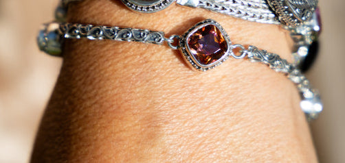 Sterling silver bracelet with gypsy red topaz and twilight topaz, linked by filigree bar panels