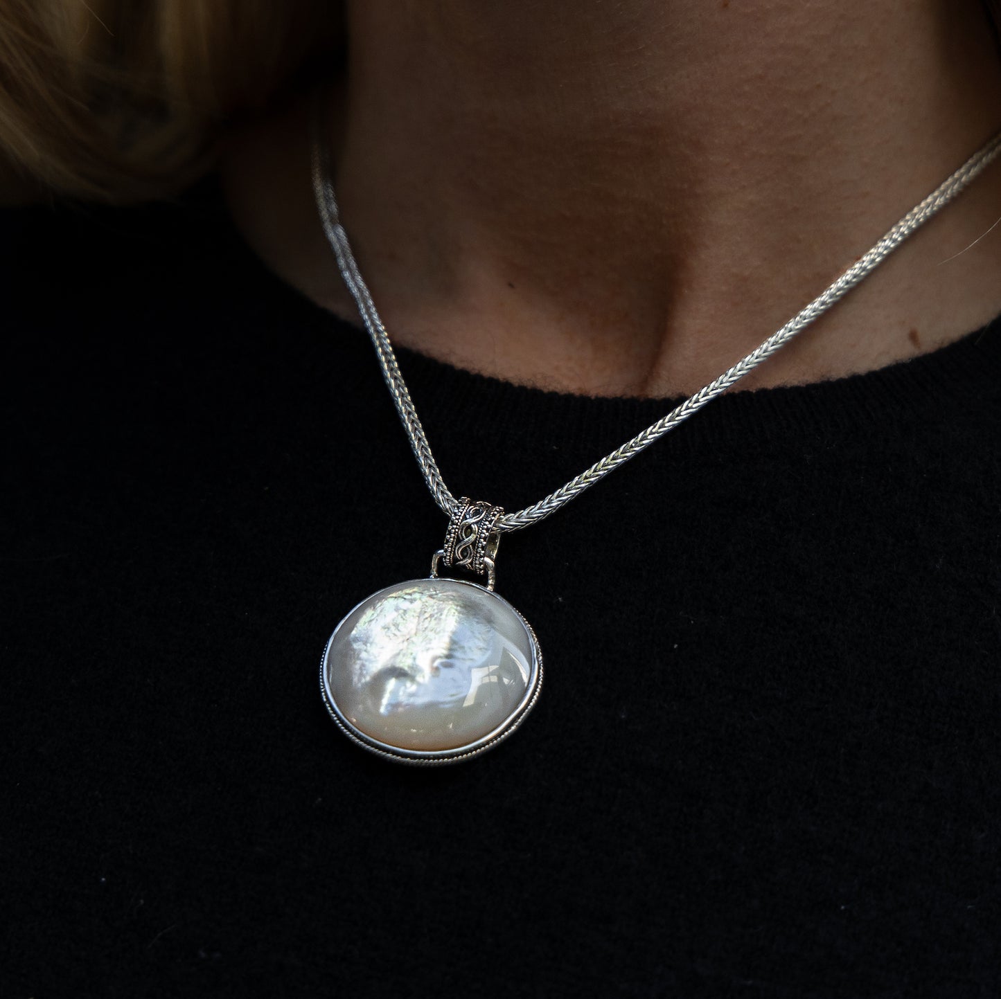 Reversible sterling silver pendant with mother of pearl and filigree detailing on an 18-inch handwoven foxtail chain from the Blush 2006 Collection.