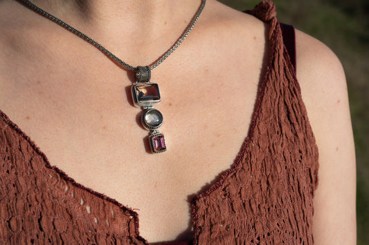 Pendant necklace with smoky quartz, twilight topaz, and black mother of pearl on woven silver snake chain