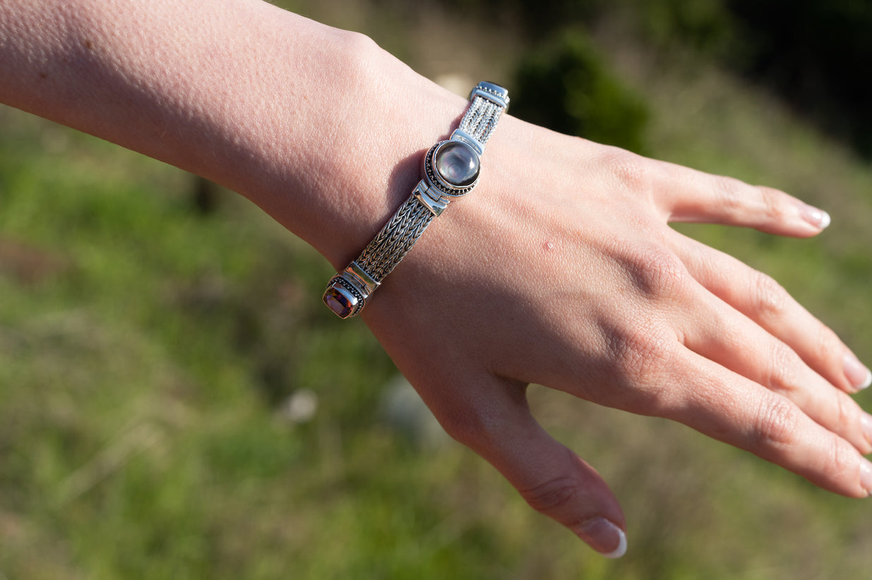 Multi-strand sterling silver bracelet with twilight topaz, gypsy red topaz, and black mother of pearl