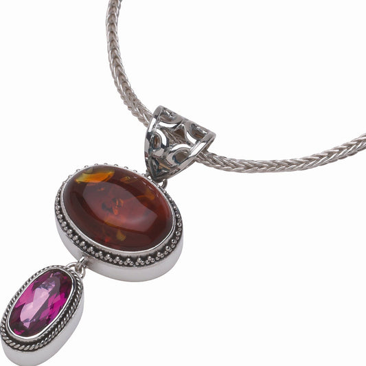Sterling silver pendant necklace with Baltic amber cabochon in granulated bezel and faceted raspberry topaz drop, open scrollwork bail, on handwoven foxtail chain. One-of-a-kind sample, Parisian Muse Collection, 2004, Lori Bonn Archive.
