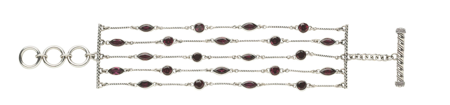 One-of-a-kind four-strand sterling silver toggle bracelet with faceted garnet stations from the Sasha 2003 Archive.