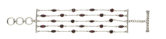 One-of-a-kind four-strand sterling silver toggle bracelet with faceted garnet stations from the Sasha 2003 Archive.